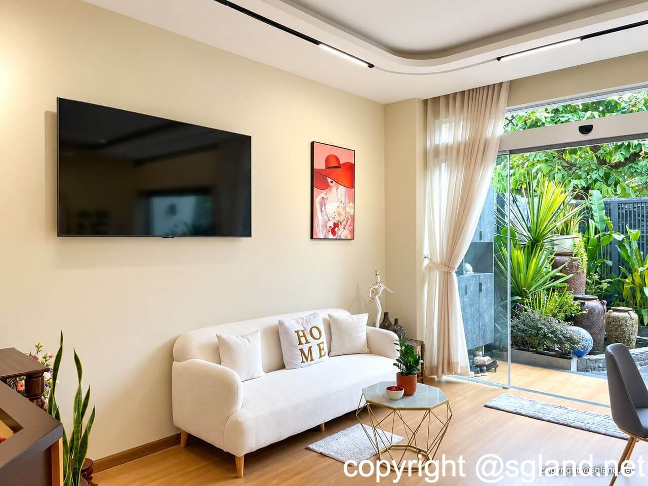 Bán nhà phố An Phú 149,4 m², 5 phòng ngủ, giá 41 tỷ 13 Khu vực tiếp khách có sofa trắng và cửa kính hướng ra cây xanh